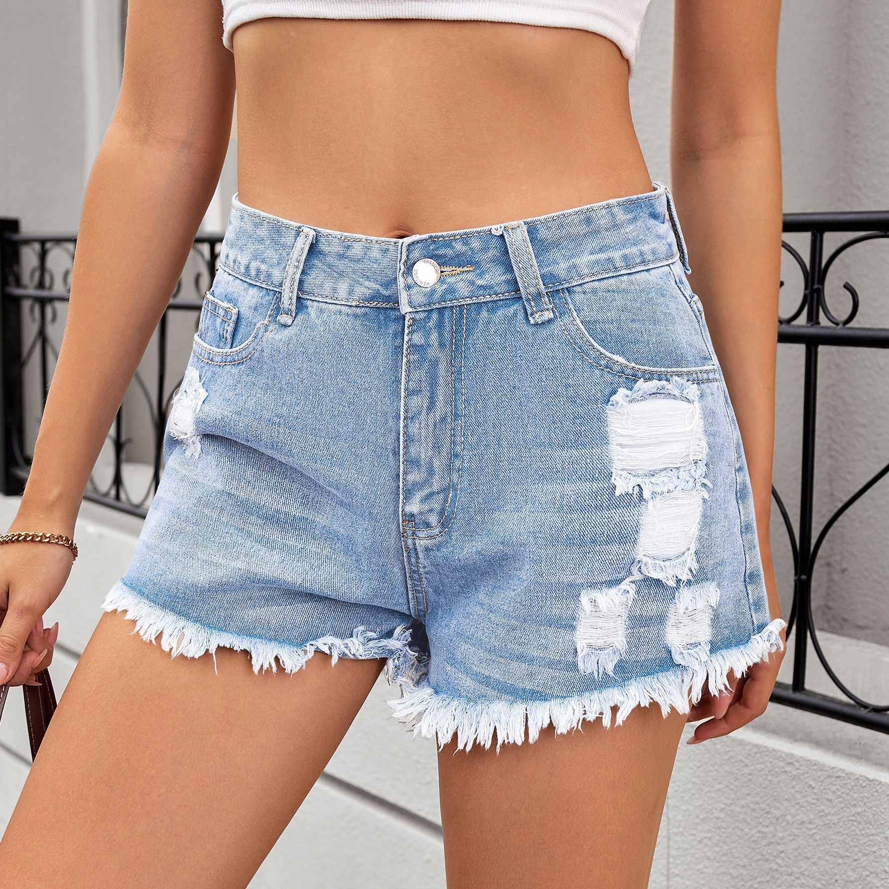 Shorts en jean déchirés pour femmes avec franges et taille haute